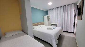 Triple Room | Minibar, individually decorated, desk, laptop workspace