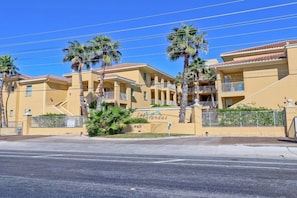 A yellow building with balconies and palm trees, labeled 'Las Vegas.'
