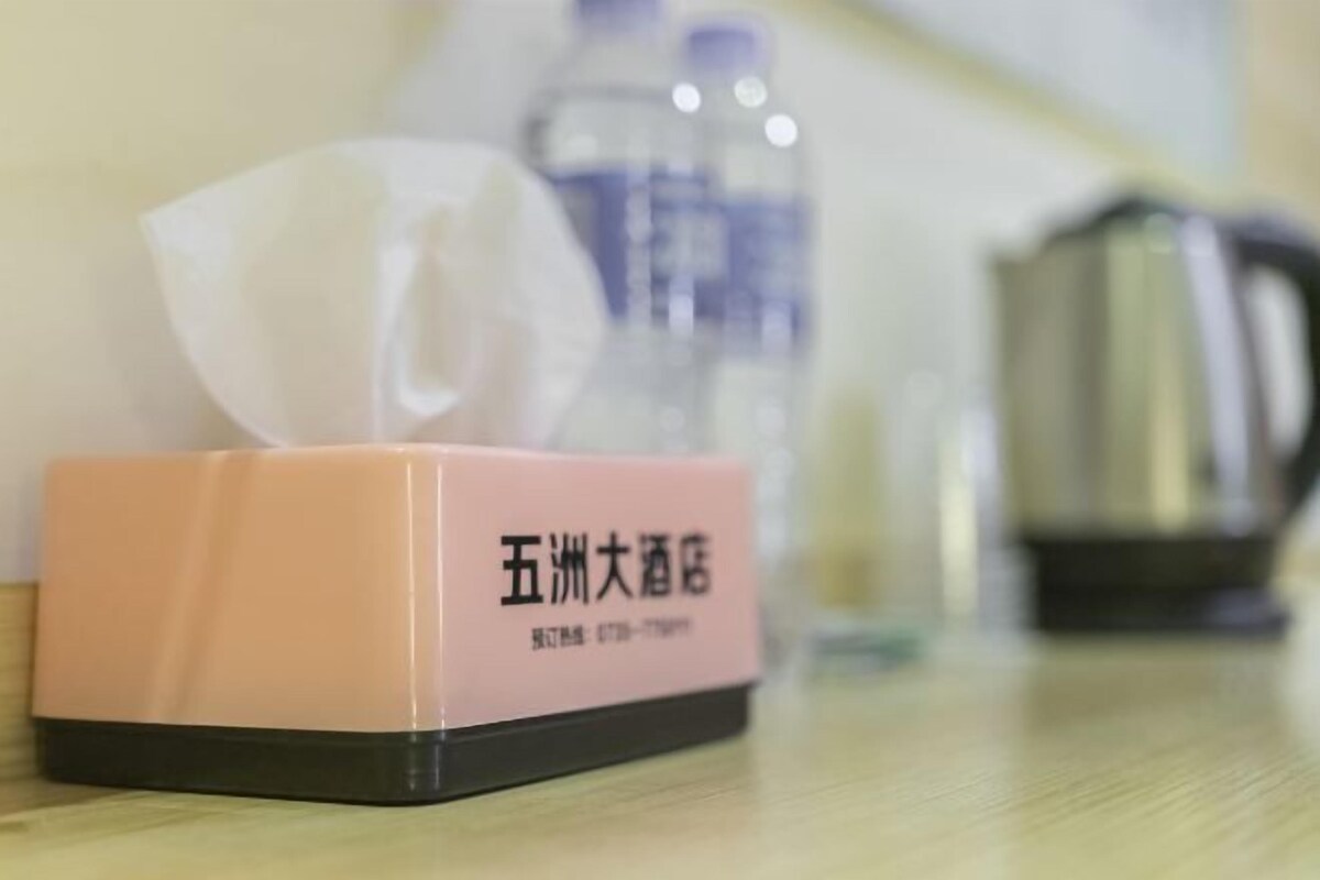 A tissue box on a table with a blurred background.