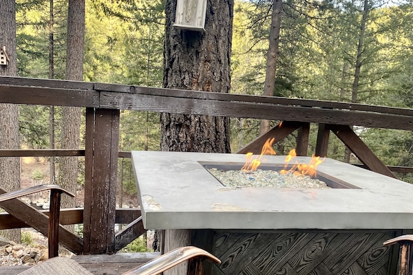 Outside fire pit table, seating, while listening to the sound of the river