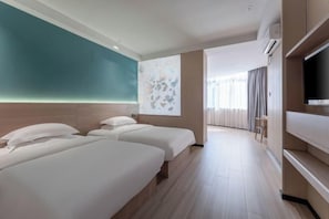 A hotel room with two beds, a television, and a large window with curtains. - Yisu Qingju Hotel (Ningbo Beilun Xiaogang) (Ningbo)