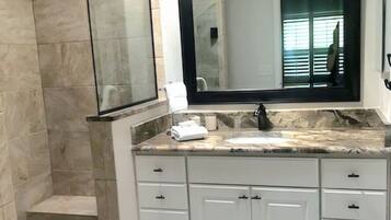 Combined shower/tub, hair dryer, towels, soap