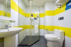 A bathroom with a glass-enclosed shower, a white sink, and a toilet. - Xiyue Hotel (Dongguan Chang'an Vanke Plaza Branch) (Dongguan)