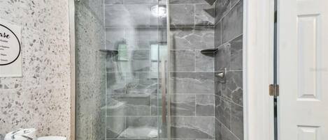 Shower, hair dryer, towels, soap