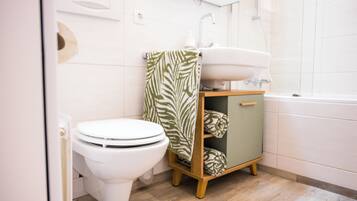 Combined shower/tub, hair dryer, towels, soap
