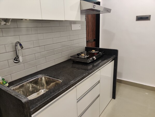 Fridge, microwave, stovetop, electric kettle - Premium 1 Bedroom Kitchen (302) (Navi Mumbai)