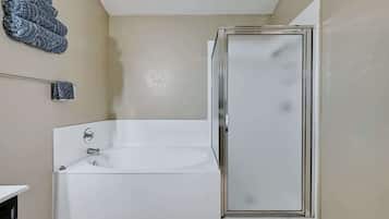 Combined shower/bathtub, hair dryer, towels, soap