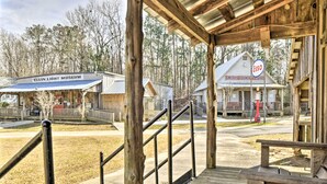 A wooden covered walkway leading to a building labeled 'Elvin Light Museum' and 'Smith's Country Store'.