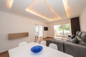 Family Apartment, 3 Bedrooms, Terrace | Living area | 32-inch plasma TV with satellite channels, TV