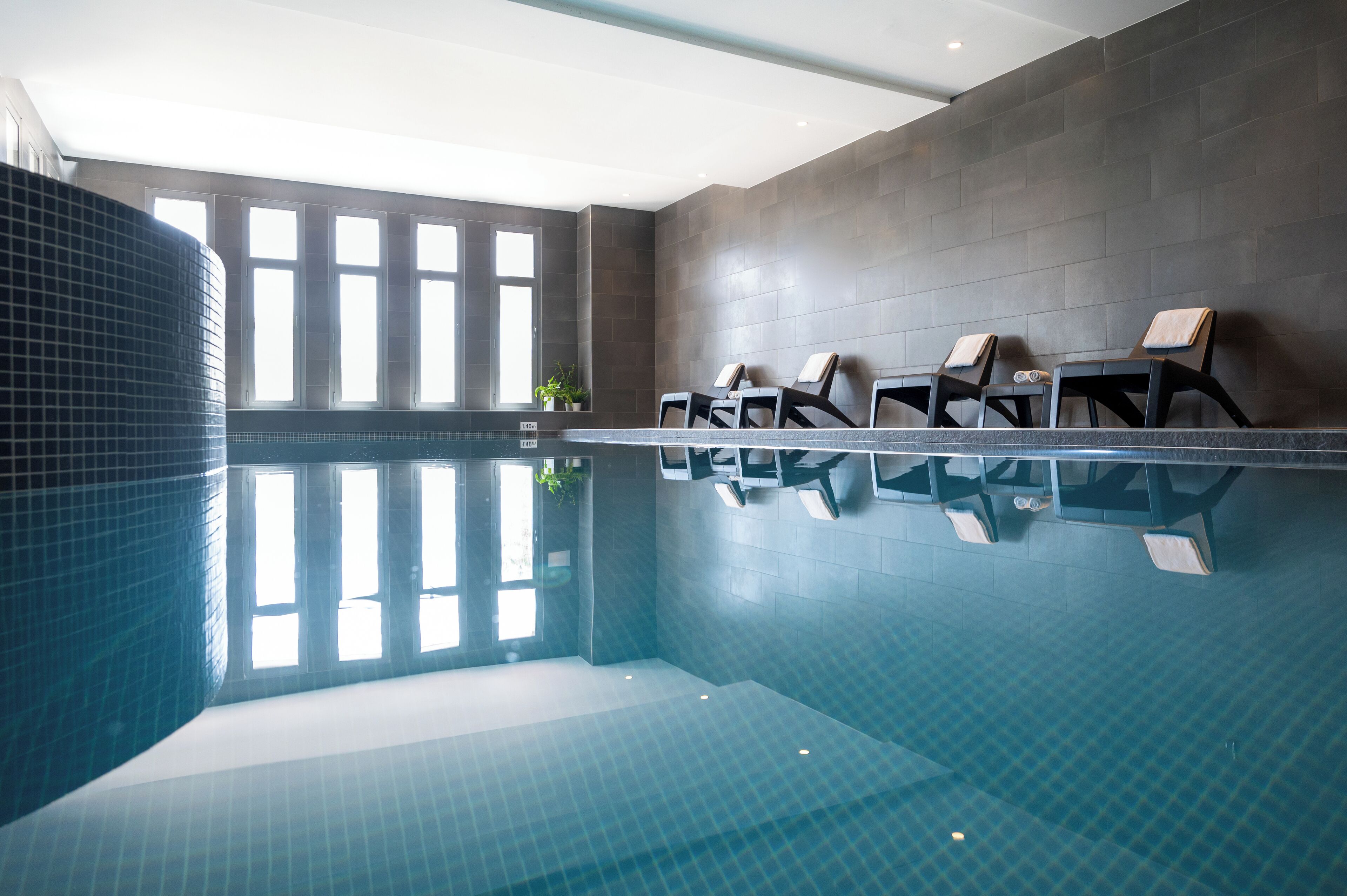 indoor pool, seasonal outdoor pool, pool loungers