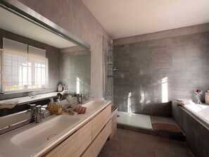 Bathtub, hair dryer, towels, soap