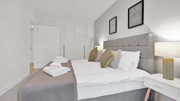 Basic Apartment | Laptop workspace, bed sheets