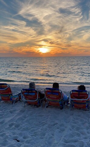 Relax in comfort on our beach with four chairs aligned for the perfect ocean view.