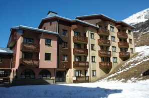 Experience the mountain views from a balcony in our hotel, offering a range of rooms with multiple windows and doors.