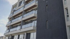 A multi-story residential building with balconies on each floor. - LaGioconda aparthotel (Villa Maria)