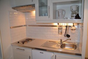 Fridge, microwave, coffee/tea maker, toaster