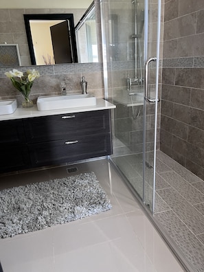 Bathtub, hair dryer, towels, soap