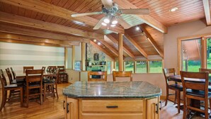 A spacious kitchen with wooden cabinets, a granite countertop, and a ceiling fan. - A spectacular space for every season-in winter a real skier's destination! (Canaan Valley)