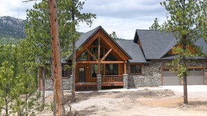 A log cabin with a stone foundation, large windows, and a porch. - 4,000 Sq. Ft. New Beautiful Lodge in Powder House and Large Deck w/ View! (Lead)