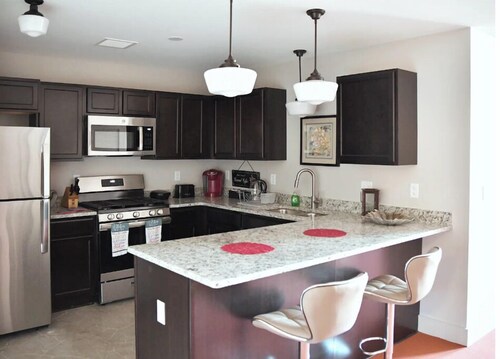 AT YOUR SERVICE! Downtown Aurora 1 Bedroom River Facing Gem