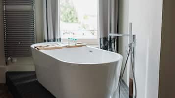 Bathtub, hair dryer, towels, soap