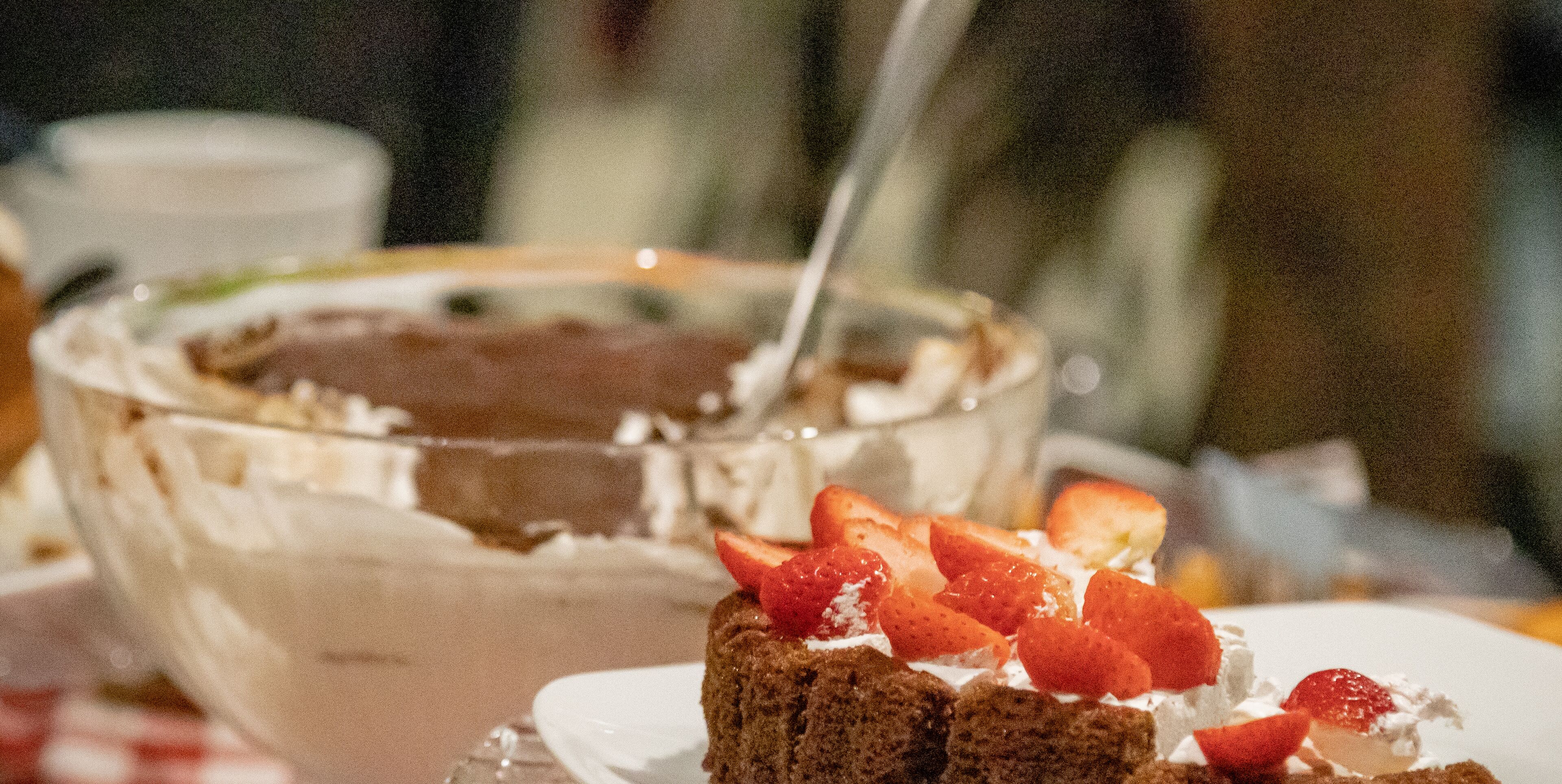 A dessert with strawberries on a plate.