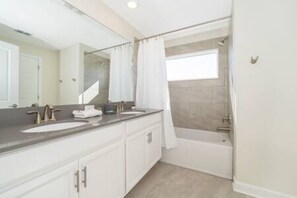 Bathtub, hair dryer, towels