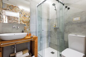 Shower, hair dryer, towels, toilet paper