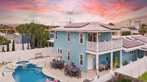 A two-story house with a pool, a balcony, and a fenced backyard. - Fam & Pet Friendly, PVT Heated Pool Steps 2 Beach (Panama City Beach)