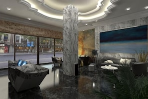 A lobby with a marble column, seating area, a large painting, and a view of the street. - Royal Hotel (Shenzhen)