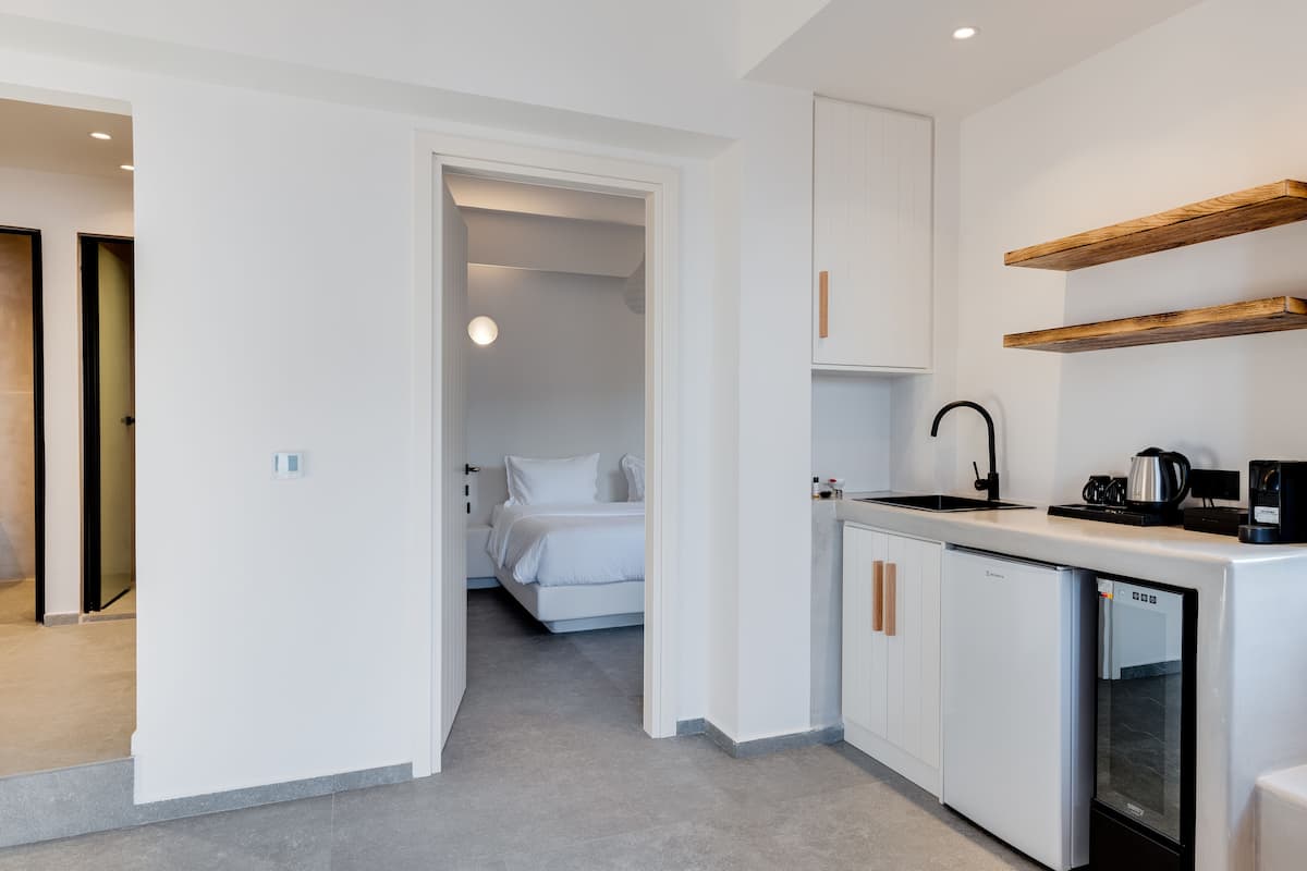 elite suite, pool view | 1 bedroom, minibar, in-room safe, individually decorated