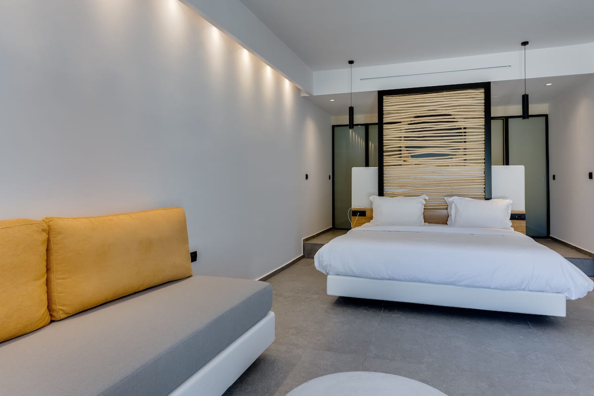 Junior Suite, Pool View | 1 bedroom, minibar, in-room safe, individually decorated
