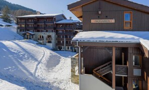 Experience the charm of Backgammon Lodge, nestled in a serene winter wonderland.