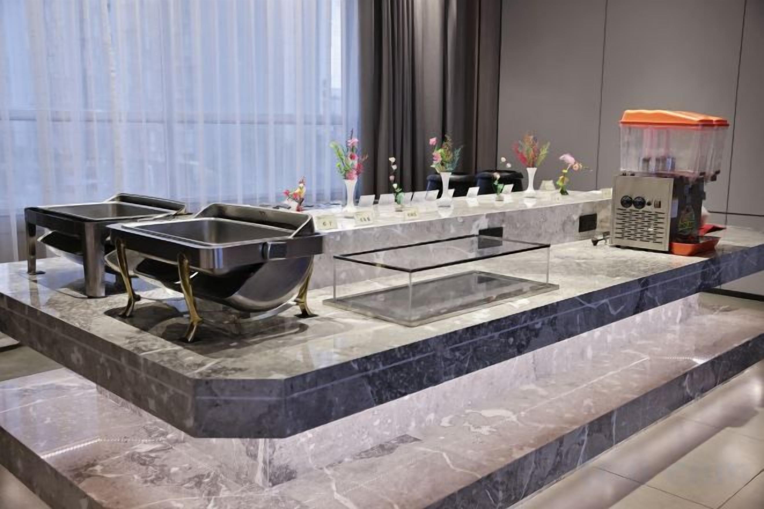 A modern bathroom with a marble countertop, two sinks, a large bathtub, and a shower area.