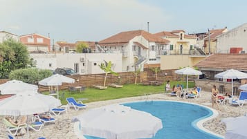 Seasonal outdoor pool, open 9:00 AM to 8:00 PM, pool umbrellas