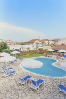 Seasonal outdoor pool, open 9:00 AM to 8:00 PM, pool umbrellas