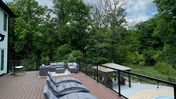 A deck with outdoor seating and a pool. - Elegant & Private Sparta Home – Pool, Deck, and Luxury Comfort (Sparta)