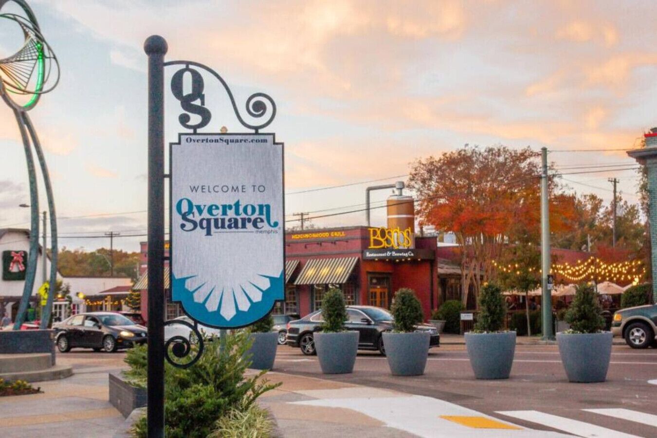 A sign welcoming visitors to Overton Square with a restaurant named 'Bistro's' in the background.