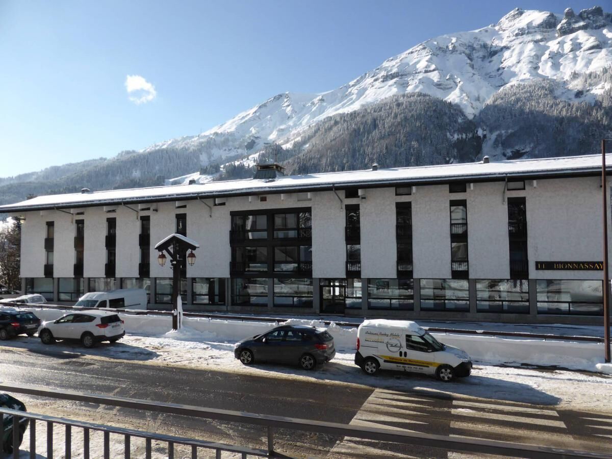 A building with a snow-covered mountain in the background.