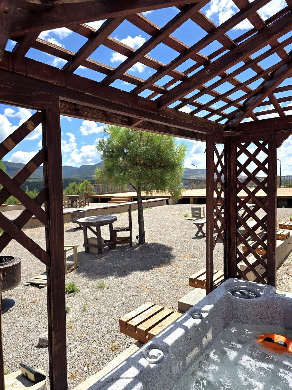 Shared hot tub, shared with neighboring units and directly outside.