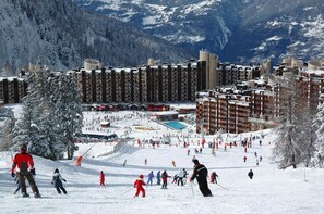 Experience the thrill of skiing and snowboarding at this resort, where guests can enjoy a range of room options with balconies overlooking the slopes.