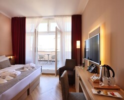 Superior kamer, terras | Hypoallergeen beddengoed, een minibar, een kluis op de kamer, een bureau