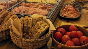 A buffet with various food items including meats, cheeses, and bread. - Hostal Es Niu de Tamariu (Palafrugell)