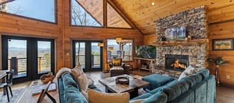 Massive mountain views, new hot tub and garage converted to a cozy TV game space