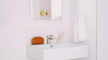 Designer toiletries, hair dryer, towels, soap