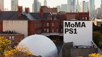 A cityscape with a large white dome structure labeled 'MoMA PS1' and a prominent building with the same name.