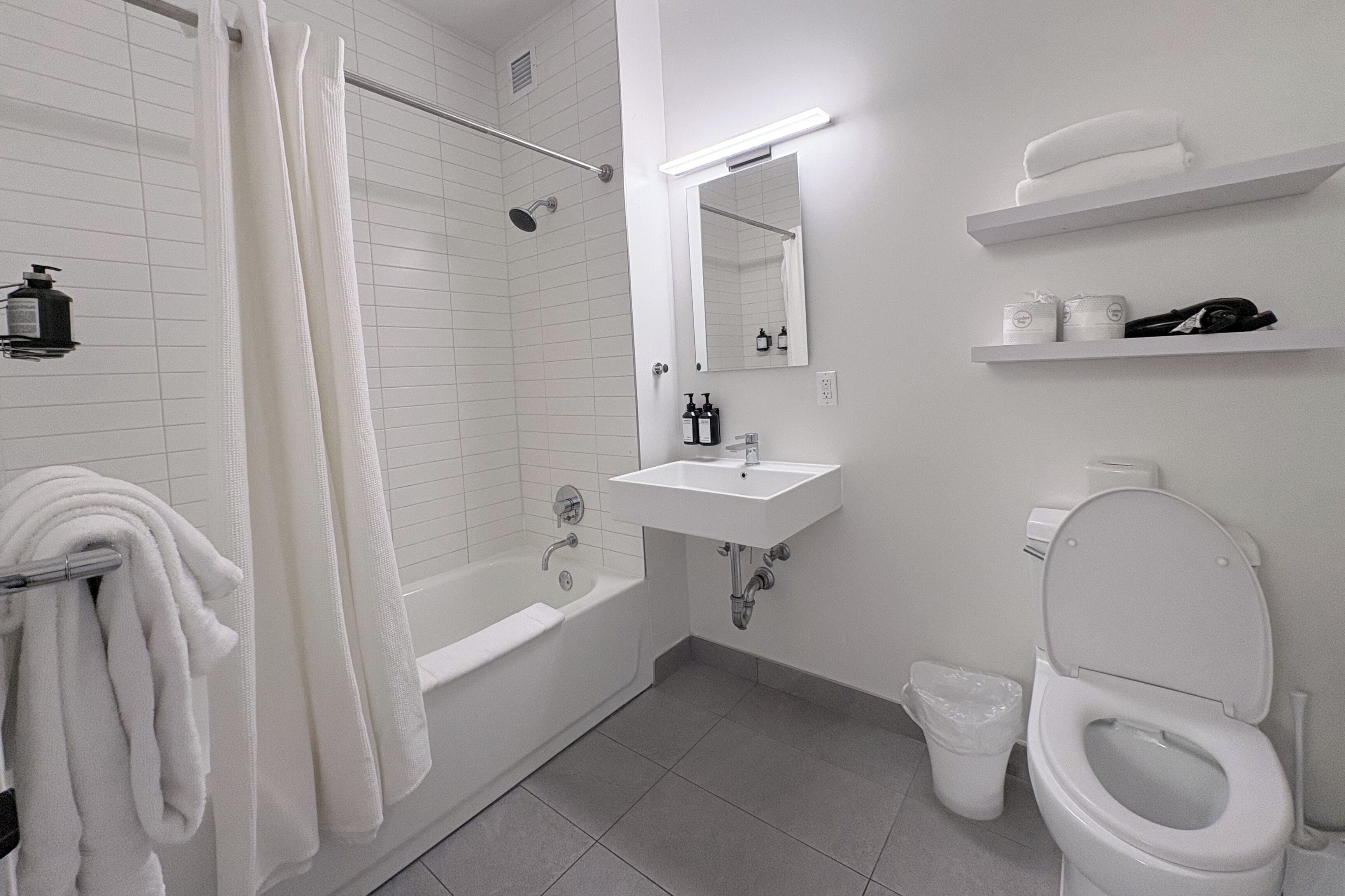 Designer toiletries, hair dryer, towels, soap