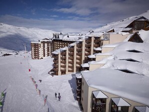 Experience the thrill of winter sports at this ski resort, where accommodations offer stunning views and easy access to slopes and lifts.