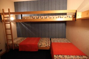 Cozy retreat with a bunk bed featuring a ladder for easy access to the upper bunk.