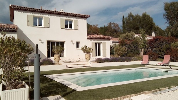 A two-story house with a swimming pool, surrounded by well-maintained lawn and potted plants. - Villa Pampérigouste - air conditioning and swimming pool (SOLLIES TOUCAS)